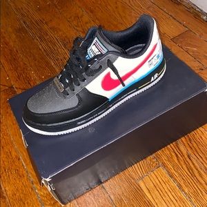 Low cut Nike Air Force ones with red Nike check